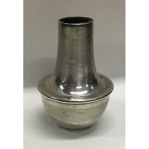 249 - A silver engine turned caster base. Birmingham. Approx. 124 grams gross weight. Est. £30 - £40.