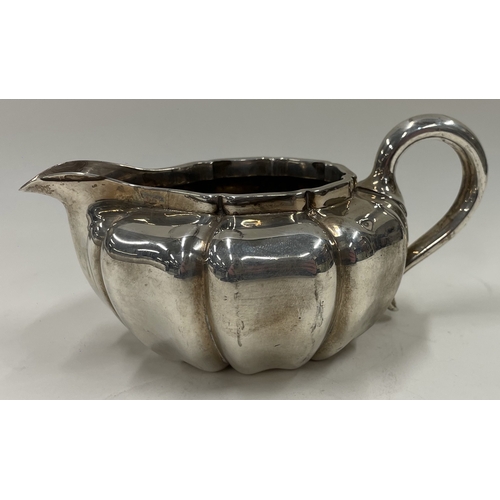 265 - PETER AND ANN BATEMAN: A fine and large oversized 18th Century George III silver bright cut cream ju... 