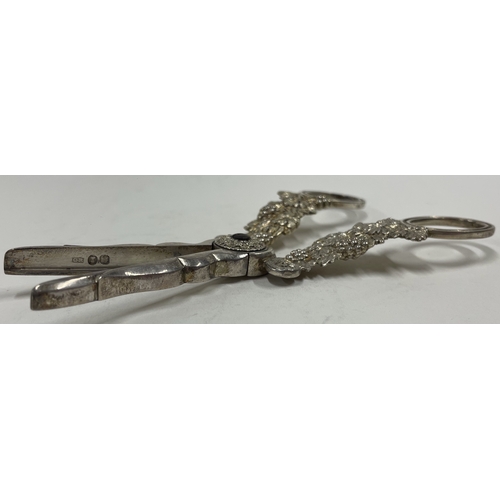 270 - A fine silver gilt pair of grape scissors heavily embossed with vines. London 1826 by Charles Rawlin... 