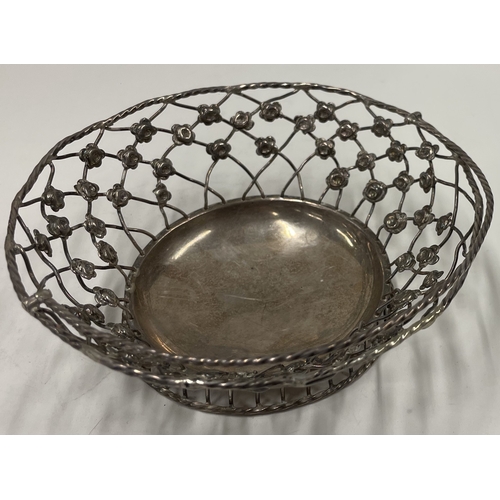 290 - A Georgian 18th Century silver pierced swing handled basket. London 1766. By John Henry Vere and Wil... 