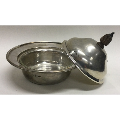 295 - An attractive silver mounted butter dish. Sheffield. Approx. 131 grams. Est. £40 - £60.