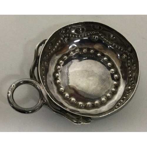 298 - A large 19th Century French silver wine taster. Approx. 55 grams. Est. £120 - £150.