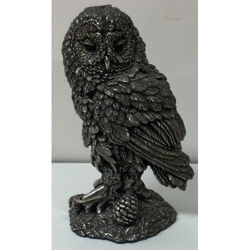 299 - A heavy silver model of an owl on a bark branch. Birmingham 1984. Est. £40 - £60.