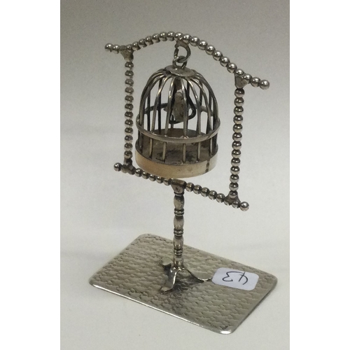 43 - A large novelty silver bird cage on stand. Approx. 28 grams. Est. £30 - £40.