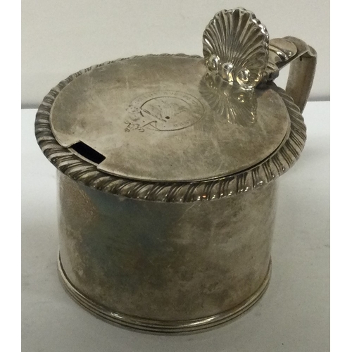 54 - A George III silver mustard pot with chased border. London circa 1820. Approx. 99 grams. Est. £100 -... 