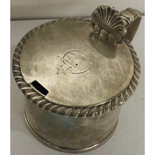 54 - A George III silver mustard pot with chased border. London circa 1820. Approx. 99 grams. Est. £100 -... 