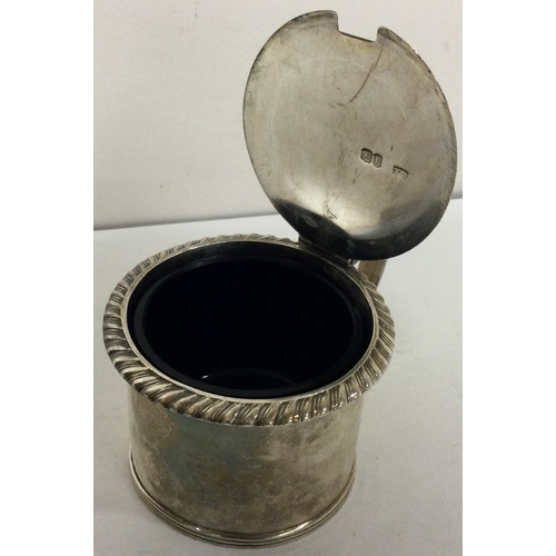 54 - A George III silver mustard pot with chased border. London circa 1820. Approx. 99 grams. Est. £100 -... 