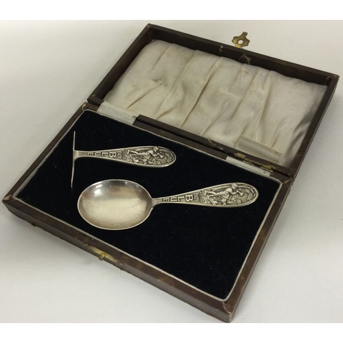 73 - GLASGOW: A rare Scottish silver christening pusher and spoon. Glasgow 1930. By WHC. Approx. 33 grams... 