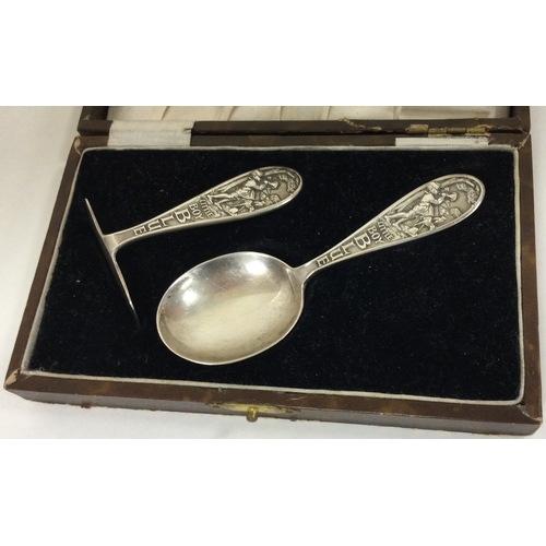 73 - GLASGOW: A rare Scottish silver christening pusher and spoon. Glasgow 1930. By WHC. Approx. 33 grams... 