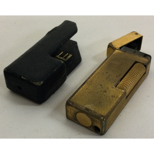 87 - A Dunhill gold plated lighter in original Dunhill sleeve. Est. £20 - £30.