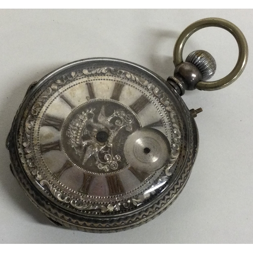 90 - A chased silver pocket watch. Approx. 82 grams. Est. £30 - £50.