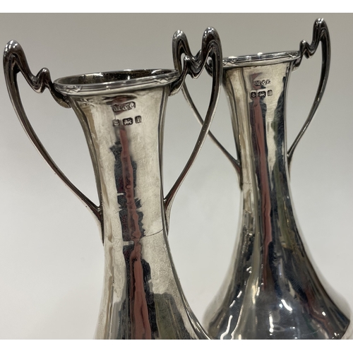 91 - A pair of silver Art Nouveau vases. Birmingham 1908. By M&C. Approx. 265 grams. Est. £120 - £150.