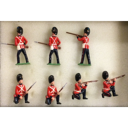 35 - BRITAINS: Seven painted soldiers. Est. £20 - £30.