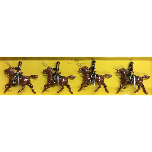 5 - BRITAINS: A boxed set of four figures on horse back. Est. £20 - £30.