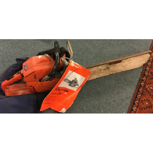 838 - A Husqvarna chain saw together with a jacket. Est. £20 - £30.