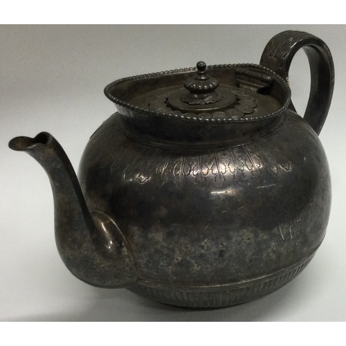 1 - A small silver teapot with fluted decoration. London. Approx. 404 grams. Est. £200 - £250.