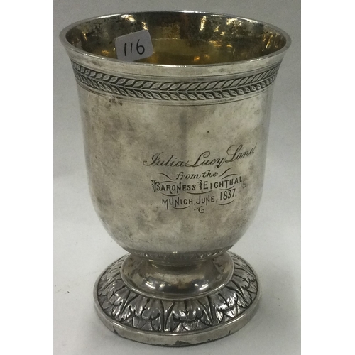 116 - An engraved German silver beaker. Marked to base. Approx. 128 grams. Est. £100 - £200.