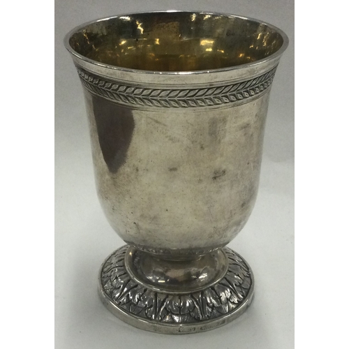 116 - An engraved German silver beaker. Marked to base. Approx. 128 grams. Est. £100 - £200.