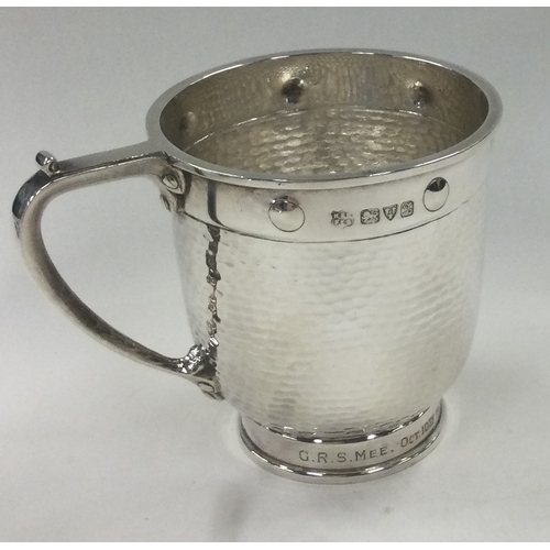 124 - CHESTER: A Glastonbury silver mug of hammered design. 1923. By Barker Brothers. Est. £150 - £200.