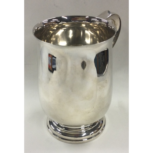 180 - An oversized silver pint mug. Sheffield 1964. By Finnigans Ltd. Approx. 530 grams. Est. £400 - £600.