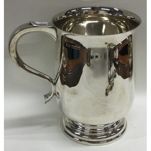 180 - An oversized silver pint mug. Sheffield 1964. By Finnigans Ltd. Approx. 530 grams. Est. £400 - £600.