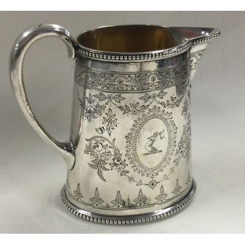 193 - An engraved Victorian silver jug. London 1871. By Alexander Macrae. Approx. 217 grams. Approx. 217 g... 