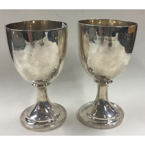 194 - A pair of 18th Century George III silver goblets. London 1776. Approx. 331 grams. Est. £600 - £800.