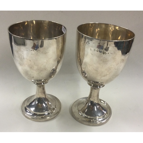 194 - A pair of 18th Century George III silver goblets. London 1776. Approx. 331 grams. Est. £600 - £800.