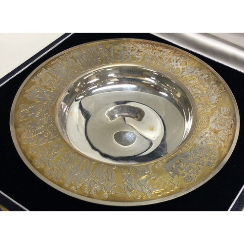 245 - GARRARD & CO: A cased silver commemorative silver dish with gilt finish. London 1988. Approx. 117 gr... 