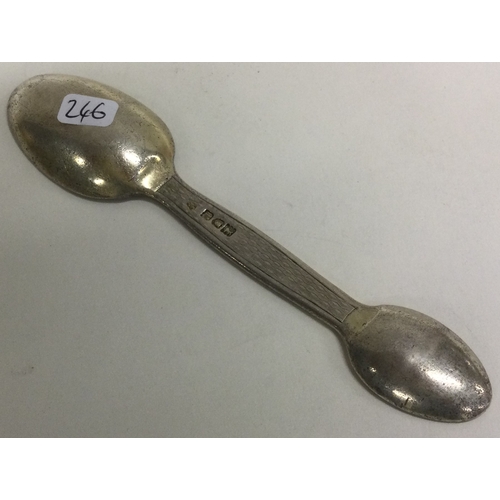 246 - An Edwardian engine turned silver feeder spoon. London 1912. Approx. 29 grams. Est. £60 - £80.