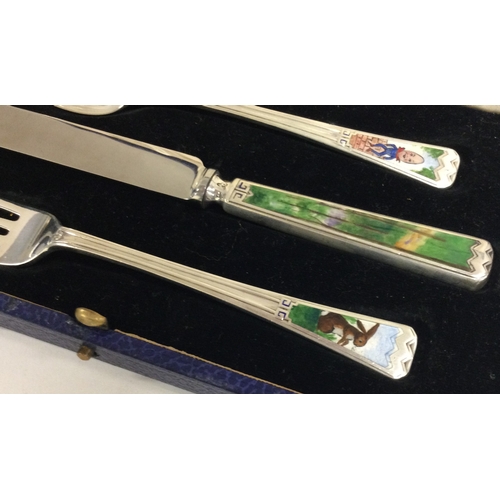 254 - A rare cased 'Humpty Dumpty' silver and enamelled christening set. Birmingham 1936. By Elkington & C... 