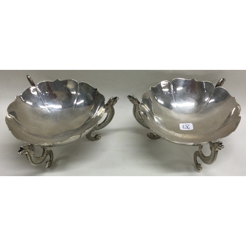 256 - WANG HING: A pair of Chinese export silver dishes with dragon feet. Approx. 256 grams. Est. £250 - £... 