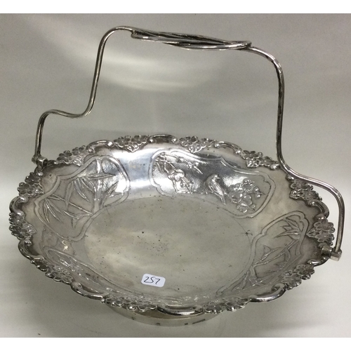 257 - YOK SANG: A Chinese export silver basket embossed with birds and bamboo. Circa 1900. Approx. 356 gra... 