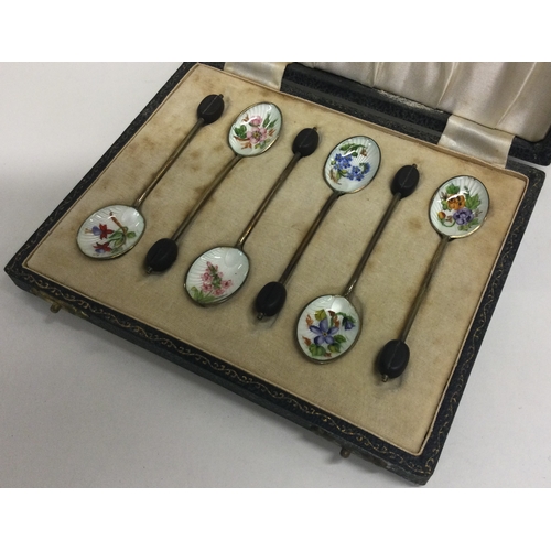 306 - A cased set of six silver and enamelled teaspoons. Birmingham. Approx. 48 grams. Est. £80 - £120.