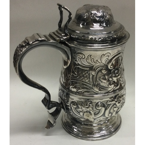 314 - An 18th Century George III silver lidded tankard. London 1772. By John Scofield. Approx. 600 grams. ... 