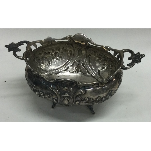 320 - A chased silver fruit basket bearing import marks. Approx. 148 grams. Est. £120 - £150.