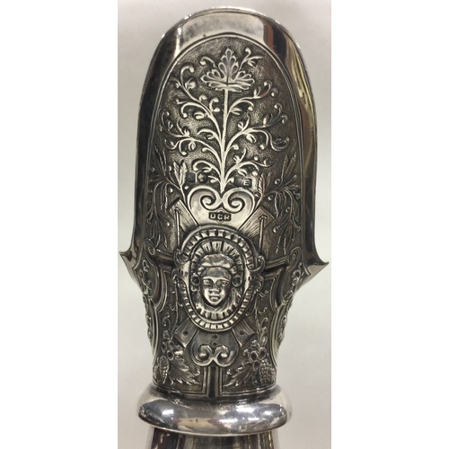 370 - GLASGOW: A large Victorian Cellini silver wine jug embossed with birds, animals, figures and vines. ... 