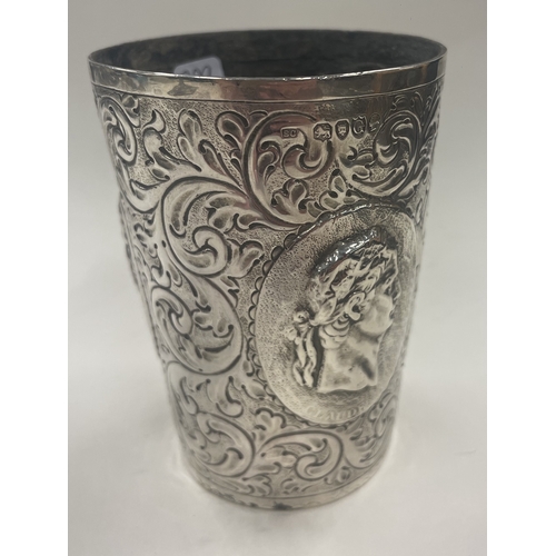 399 - OF MYTHOLOGICAL INTEREST: A rare and unusual Victorian silver beaker embossed with the bust of the R... 