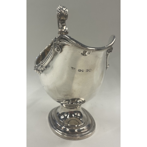 400 - A  large Victorian silver sauce boat embossed with flowers. London 1838. B Edward & John Barnard. Ap... 