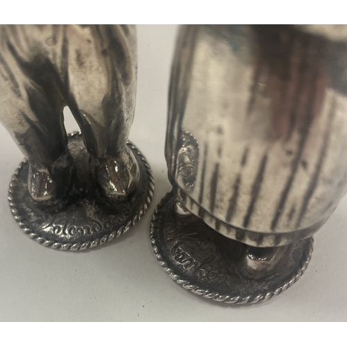 403 - A pair of Dutch silver peppers in the form of a man and woman. Signed by maker. Approx. 105 grams. E... 