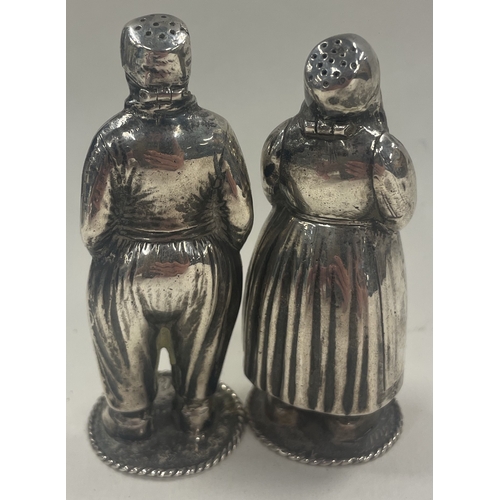 403 - A pair of Dutch silver peppers in the form of a man and woman. Signed by maker. Approx. 105 grams. E... 