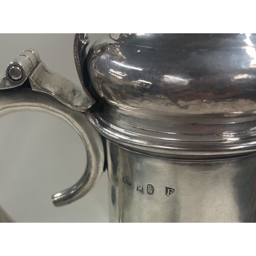 404 - A good quality Britannia Standard George I silver flagon. London 1721. By SA. Approx. 1250 grams. Es... 