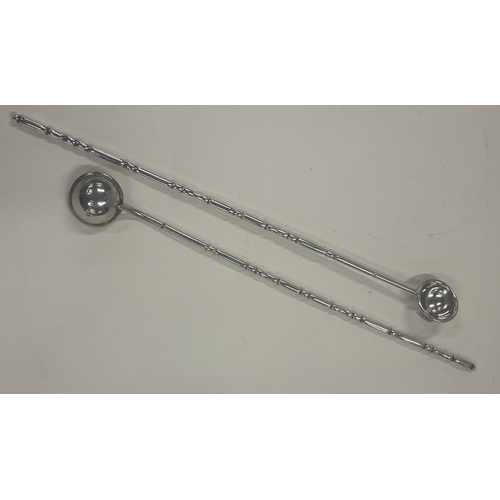 413 - EDINBURGH: A pair of Scottish silver cocktail stirrers.1904. By Brook & Son. Approx. 58 grams. Est. ... 