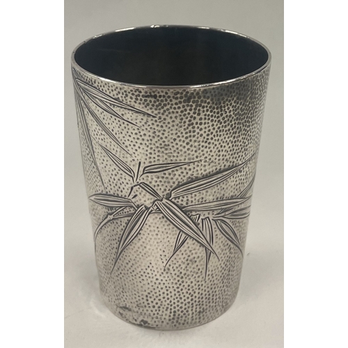 417 - A Chinese silver beaker engraved with bamboo. Approx.46 grams. Est. £60 - £80.