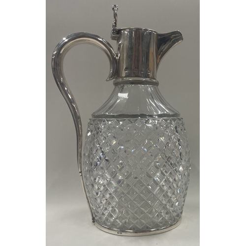 428 - A Victorian silver mounted glass claret jug. Birmingham 1896. By Plante & Co. Est. £300 - £500.