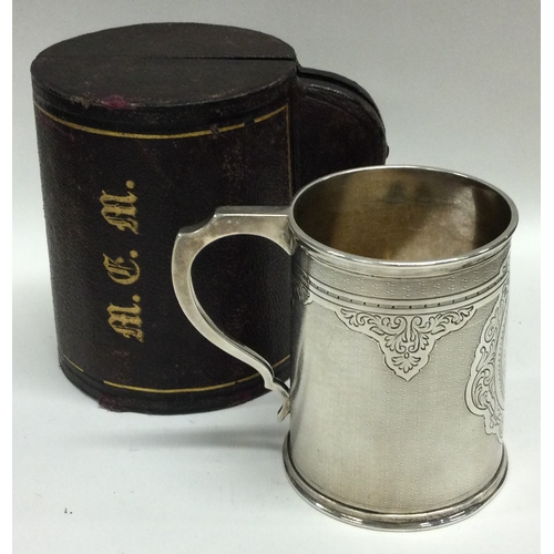 461 - A heavy engine turned silver christening mug. London 1870. By Barnards. Approx. 121 grams. Est. £200... 