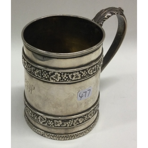 477 - A George III silver mug with vine decoration. London. By Barnards. Approx. 167 grams. Est. £200 - £3... 