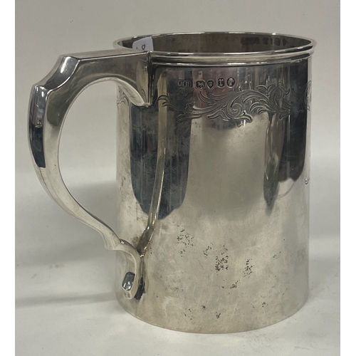 48 - A large Victorian silver engraved presentation pint mug. London 1872. By Henry Holland. Approx. 293 ... 