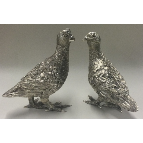 81 - A fine pair of textured silver partridges. Approx.1022 grams. Est. £1500 - £2000.