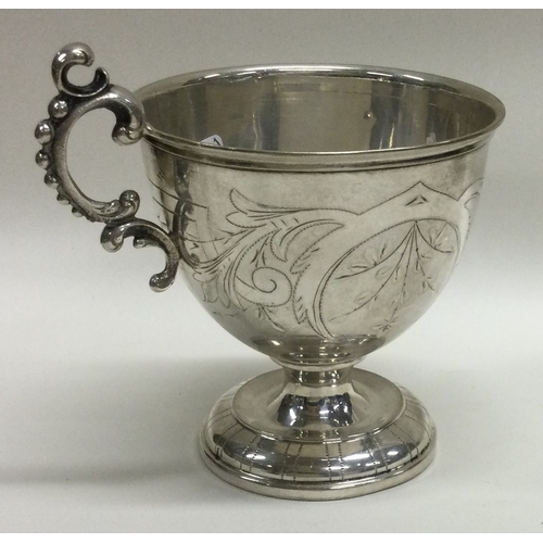 361 - A Continental silver cup with beaded handle. Approx. 100 grams. Est. £100 - £200.